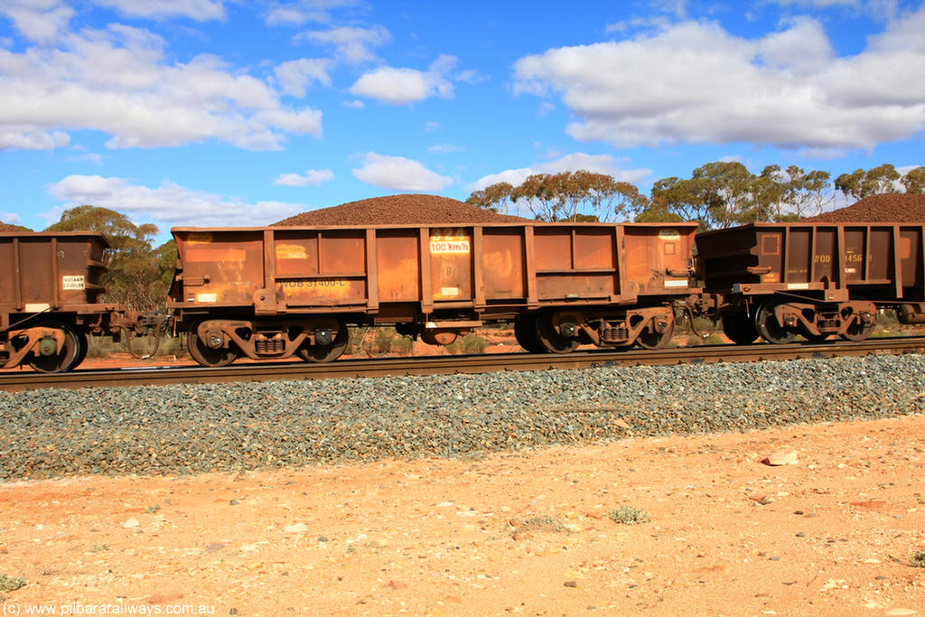 100731 02894
WOB type iron ore waggon WOB 31400 is one of a batch of twenty five built by Comeng WA between 1974 and 1975 and converted from Mt Newman high sided waggons by WAGR Midland Workshops with a capacity of 67 tons with fleet number 324 for Koolyanobbing iron ore operations. This waggon was also converted to a WSM type ballast hopper by re-fitting the cut down top section and having bottom discharge doors fitted, converted back to WOB in 1998, on loaded train 7415 at Binduli Triangle, 31st July 2010.
Keywords: WOB-type;WOB31400;Comeng-WA;WSM-type;Mt-Newman-Mining;
