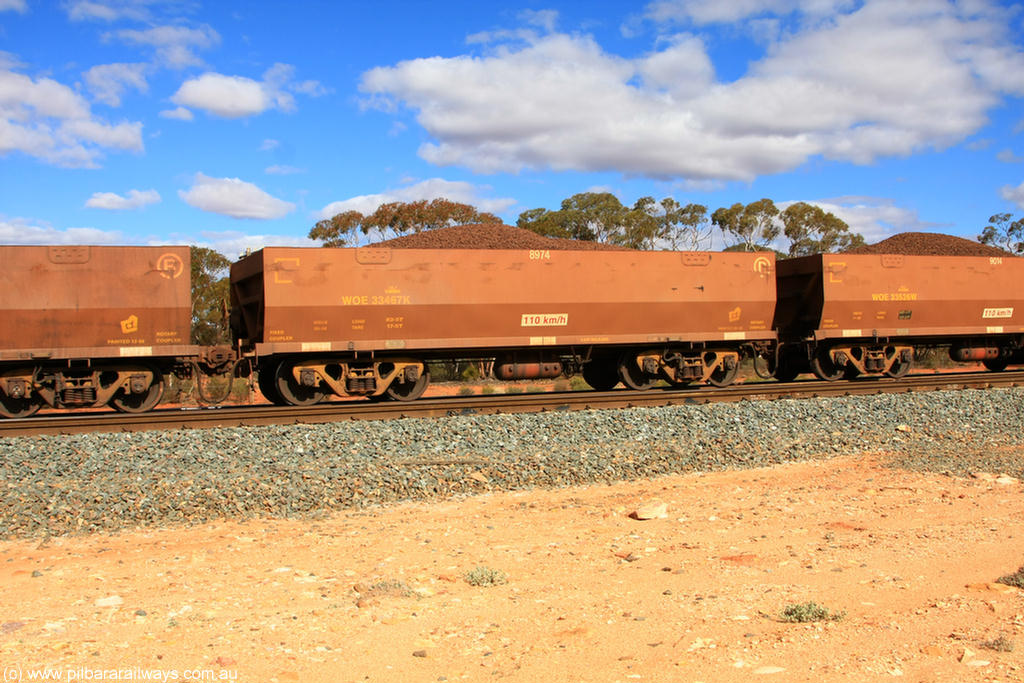 100731 02903
WOE type iron ore waggon WOE 33467 is one of a batch of one hundred and twenty eight built by United Group Rail WA between August 2008 and March 2009 with serial number 950211-009 and fleet number 8974 for Koolyanobbing iron ore operations, on loaded train 7415 at Binduli Triangle, 31st July 2010.
Keywords: WOE-type;WOE33467;United-Group-Rail-WA;950211-009;