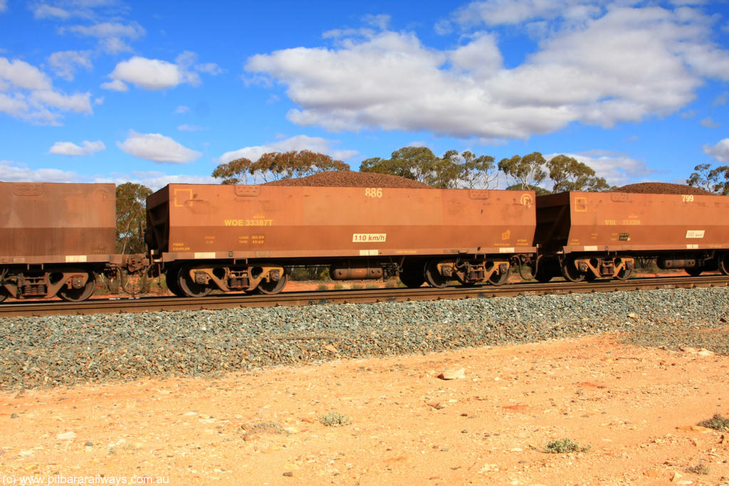 100731 02909
WOE type iron ore waggon WOE 33387 is one of a batch of one hundred and forty one built by United Group Rail WA between November 2005 and April 2006 with serial number 950142-092 and fleet number 886 for Koolyanobbing iron ore operations, on loaded train 7415 at Binduli Triangle, 31st July 2010.
Keywords: WOE-type;WOE33387;United-Group-Rail-WA;950142-092;