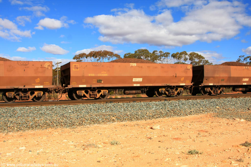 100731 02910
WOE type iron ore waggon WOE 33300 is one of a batch of one hundred and forty one built by United Goninan WA between November 2005 and April 2006 with serial number 950142-005 and fleet number 799 for Koolyanobbing iron ore operations, on loaded train 7415 at Binduli Triangle, 31st July 2010.
Keywords: WOE-type;WOE33300;United-Goninan-WA;950142-005;