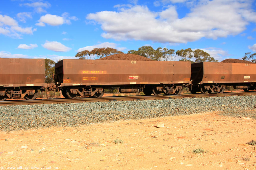 100731 02912
WOE type iron ore waggon WOE 30263 is one of a batch of one hundred and thirty built by Goninan WA between March and August 2001 with serial number 950092-013 and fleet number 611 for Koolyanobbing iron ore operations, on loaded train 7415 at Binduli Triangle, 31st July 2010.
Keywords: WOE-type;WOE30263;Goninan-WA;950092-013;