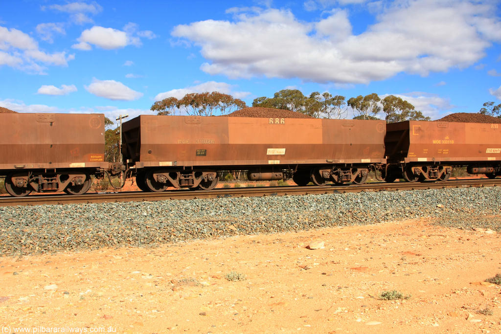 100731 02913
WOE type iron ore waggon WOE 31102 is one of a batch of one hundred and thirty built by Goninan WA between March and August 2001 with serial number 950092-092 and fleet number 686 for Koolyanobbing iron ore operations, on loaded train 7415 at Binduli Triangle, 31st July 2010.
Keywords: WOE-type;WOE31102;Goninan-WA;950092-092;
