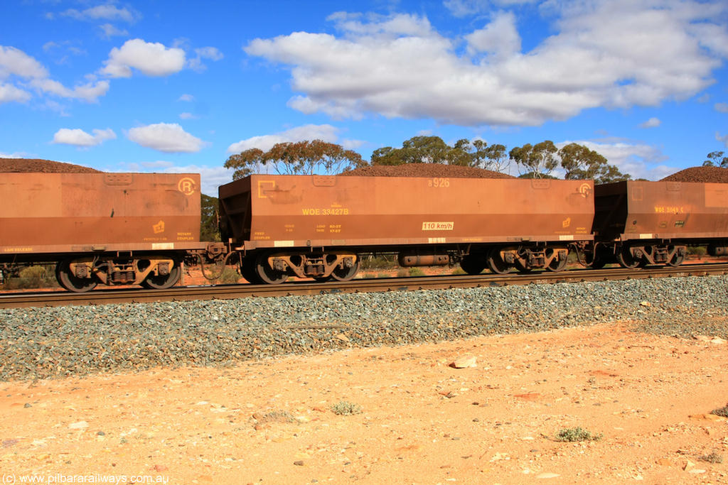 100731 02926
WOE type iron ore waggon WOE 33427 is one of a batch of one hundred and forty one built by United Group Rail WA between November 2005 and April 2006 with serial number 950142-132 and fleet number 8926 for Koolyanobbing iron ore operations, on loaded train 7415 at Binduli Triangle, 31st July 2010.
Keywords: WOE-type;WOE33427;United-Group-Rail-WA;950142-132;