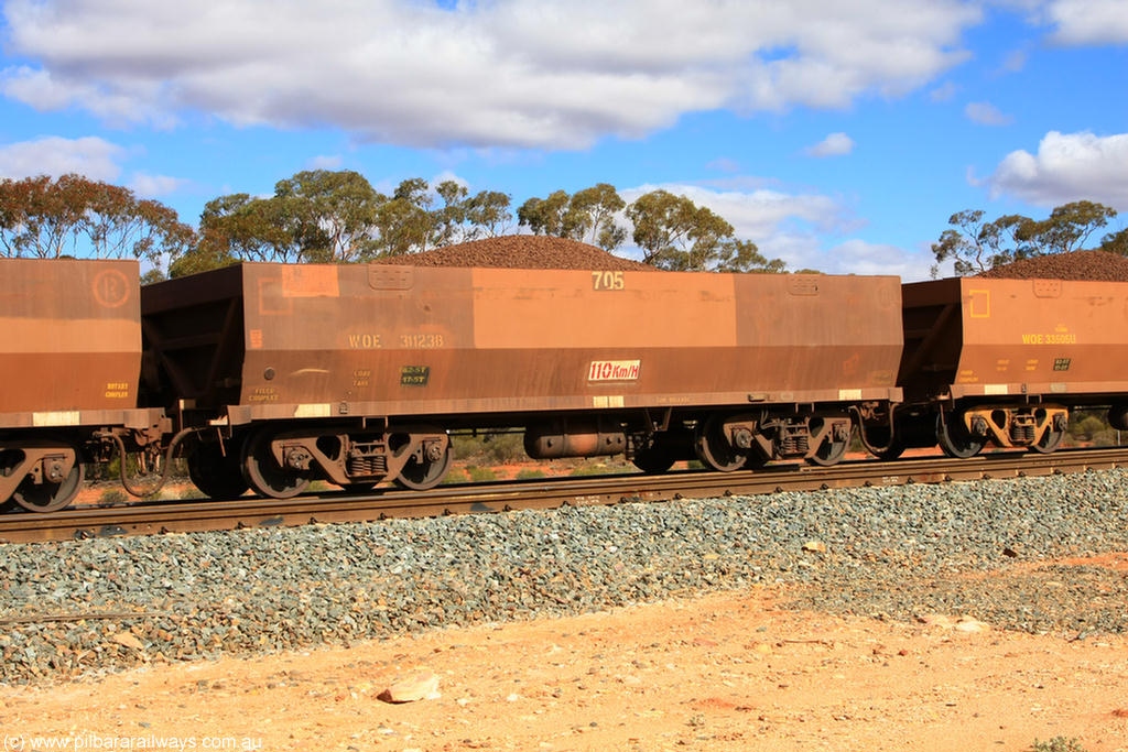 100731 02929
WOE type iron ore waggon WOE 31123 is one of a batch of one hundred and thirty built by Goninan WA between March and August 2001 with serial number 950092-113 and fleet number 705 for Koolyanobbing iron ore operations, on loaded train 7415 at Binduli Triangle, 31st July 2010.
Keywords: WOE-type;WOE31123;Goninan-WA;950092-113;