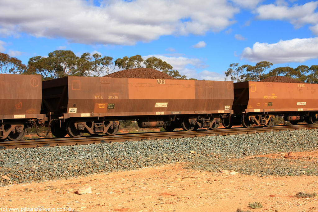 100731 02933
WOE type iron ore waggon WOE 31121 is one of a batch of one hundred and thirty built by Goninan WA between March and August 2001 with serial number 950092-111 and fleet number 703 for Koolyanobbing iron ore operations, on loaded train 7415 at Binduli Triangle, 31st July 2010.
Keywords: WOE-type;WOE31121;Goninan-WA;950092-111;