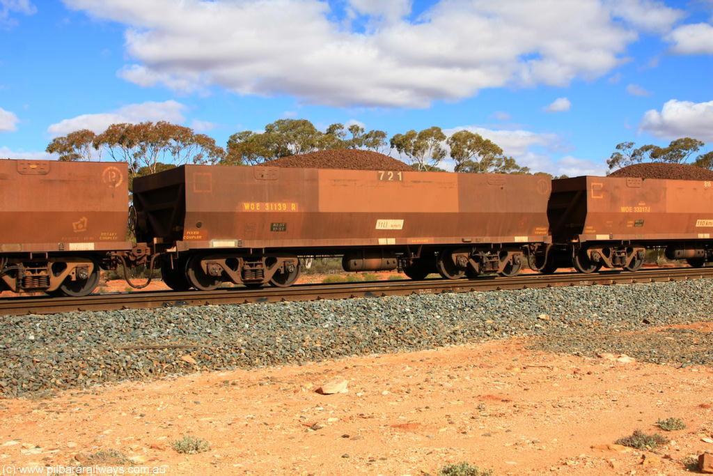 100731 02936
WOE type iron ore waggon WOE 31139 is one of a batch of one hundred and thirty built by Goninan WA between March and August 2001 with serial number 950092-129 and fleet number 721 for Koolyanobbing iron ore operations, on loaded train 7415 at Binduli Triangle, 31st July 2010.
Keywords: WOE-type;WOE31139;Goninan-WA;950092-129;