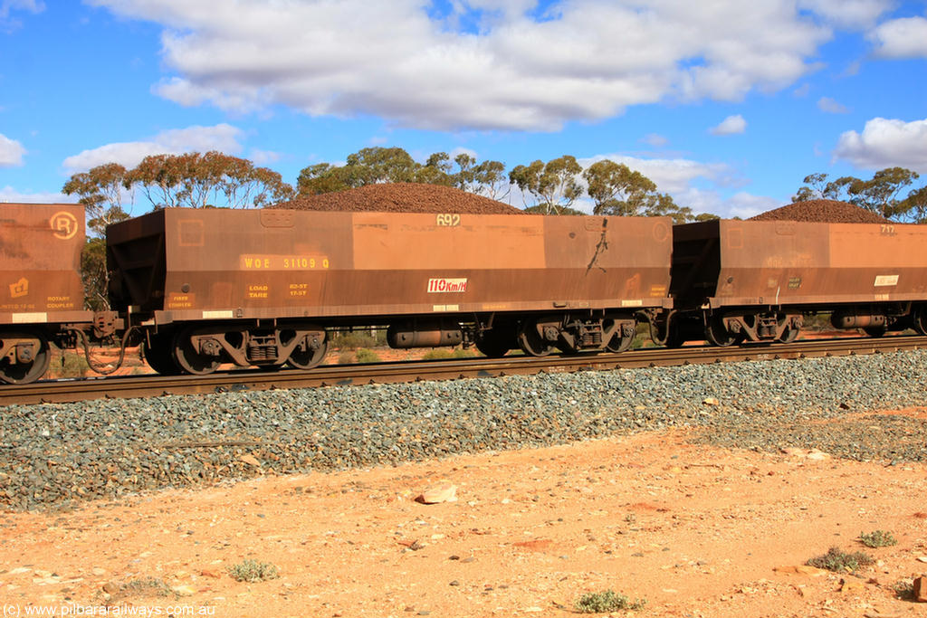 100731 02938
WOE type iron ore waggon WOE 31109 is one of a batch of one hundred and thirty built by Goninan WA between March and August 2001 with serial number 950092-099 and fleet number 692 for Koolyanobbing iron ore operations, on loaded train 7415 at Binduli Triangle, 31st July 2010.
Keywords: WOE-type;WOE31109;Goninan-WA;950092-099;