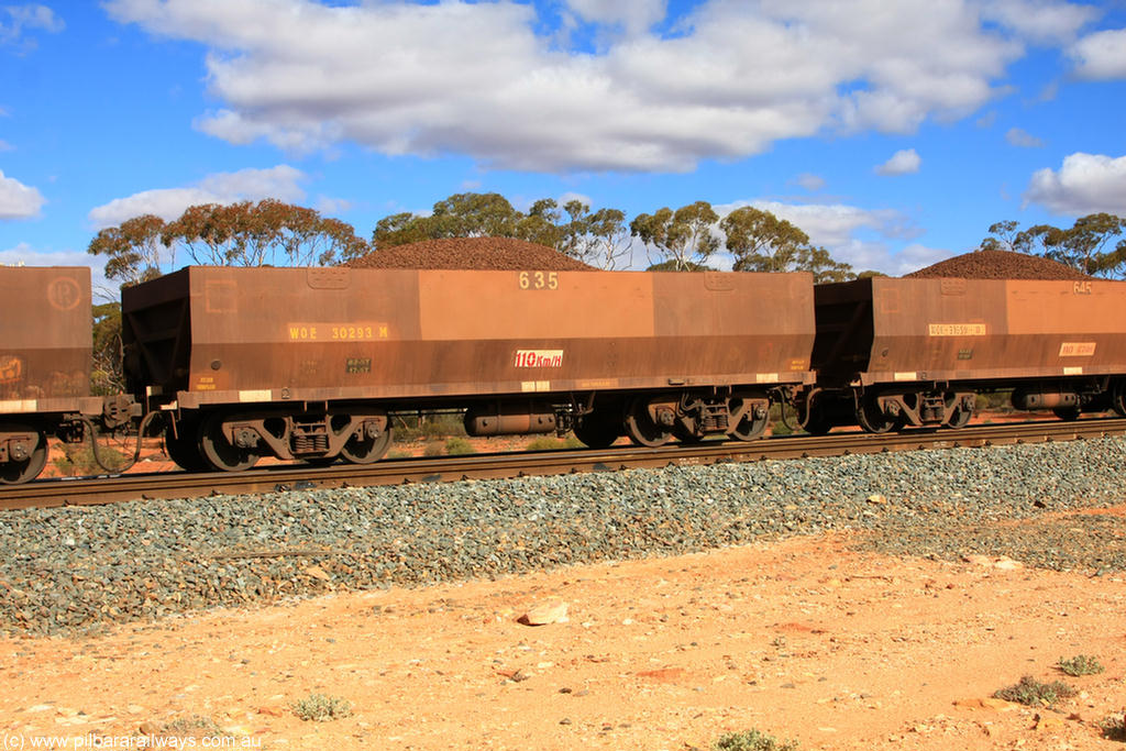 100731 02940
WOE type iron ore waggon WOE 30293 is one of a batch of one hundred and thirty built by Goninan WA between March and August 2001 with serial number 950092-043 and fleet number 635 for Koolyanobbing iron ore operations, on loaded train 7415 at Binduli Triangle, 31st July 2010.
Keywords: WOE-type;WOE30293;Goninan-WA;950092-043;