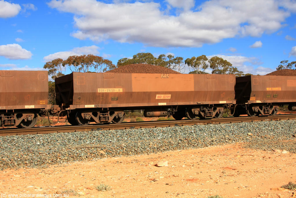 100731 02941
WOE type iron ore waggon WOE 31059 is one of a batch of fifteen built by Goninan WA between April and May 2002 with fleet number 645 for Koolyanobbing iron ore operations, on loaded train 7415 at Binduli Triangle, 31st July 2010.
Keywords: WOE-type;WOE31059;Goninan-WA;
