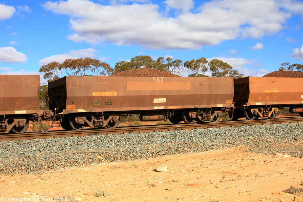 100731 02942
WOE type iron ore waggon WOE 31077 is one of a batch of one hundred and thirty built by Goninan WA between March and August 2001 with serial number 950092-067 and fleet number 662 for Koolyanobbing iron ore operations on loaded train 7415 at Binduli Triangle, 31st July 2010.
Keywords: WOE-type;WOE31077;Goninan-WA;950092-067;