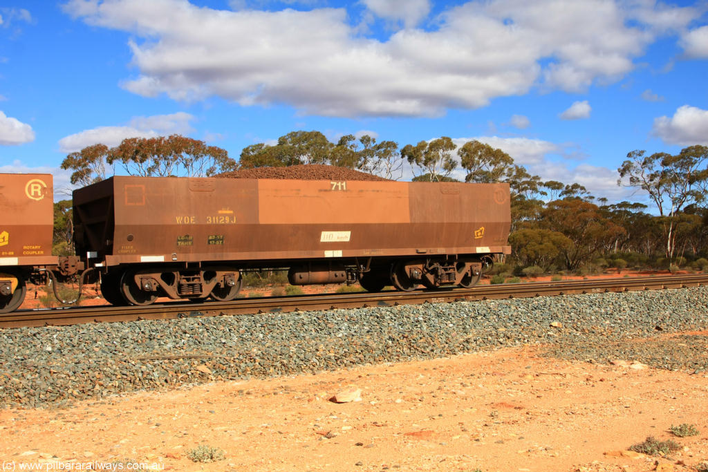 100731 02948
WOE type iron ore waggon WOE 31129 is one of a batch of one hundred and thirty built by Goninan WA between March and August 2001 with serial number 950092-119 and fleet number 711 for Koolyanobbing iron ore operations, on loaded train 7415 at Binduli Triangle, 31st July 2010.
Keywords: WOE-type;WOE31129;Goninan-WA;950092-119;