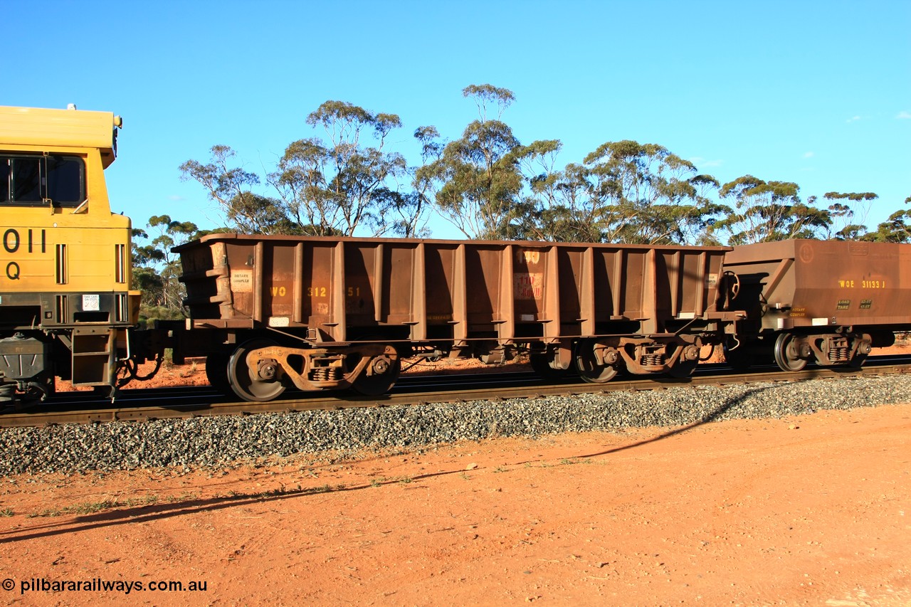 100731 03056
WO type iron ore waggon WO 31251 is one of a batch of eighty six built by WAGR Midland Workshops between 1967 and March 1968 with fleet number 140 for Koolyanobbing iron ore operations, with a 75 ton and 1018 ft³ capacity, empty train arriving at Binduli Triangle, 31st July 2010. This unit was converted to WOC for coal in 1986 till 1990 when it was reclassed to WOG for gypsum, then it was re-classed back to WO in 1994.
Keywords: WO-type;WO31251;WAGR-Midland-WS;