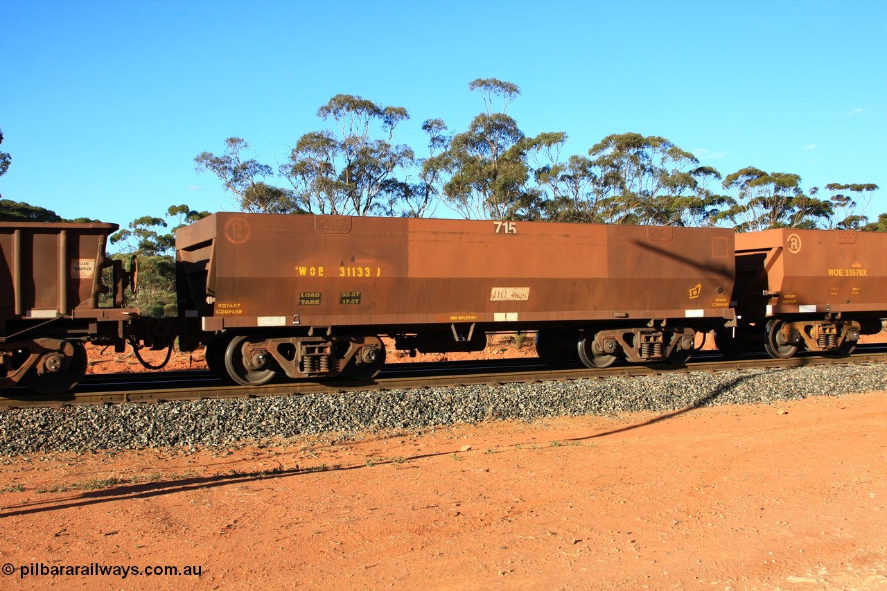 100731 03057
WOE type iron ore waggon WOE 31133 is one of a batch of one hundred and thirty built by Goninan WA between March and August 2001 with serial number 950092-123 and fleet number 715 for Koolyanobbing iron ore operations with PORTMAN painted out and a revised load of 82.5 tonnes, empty train arriving at Binduli Triangle, 31st July 2010.
Keywords: WOE-type;WOE31133;Goninan-WA;950092-123;