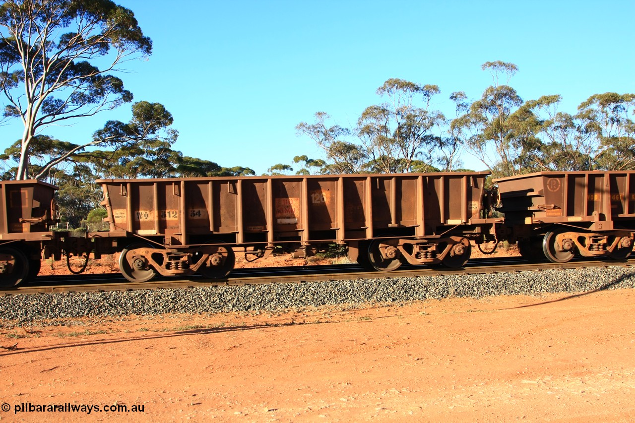 100731 03075
WO type iron ore waggon WO 31234 is one of a batch of eighty six built by WAGR Midland Workshops between 1967 and March 1968 with fleet number 126 for Koolyanobbing iron ore operations, with a 75 ton and 1018 ft³ capacity, empty train arriving at Binduli Triangle, 31st July 2010. This unit was converted to WOS superphosphate in the late 1980s till 1994 when it was re-classed back to WO.
Keywords: WO-type;WO31234;WAGR-Midland-WS;WOS-type;