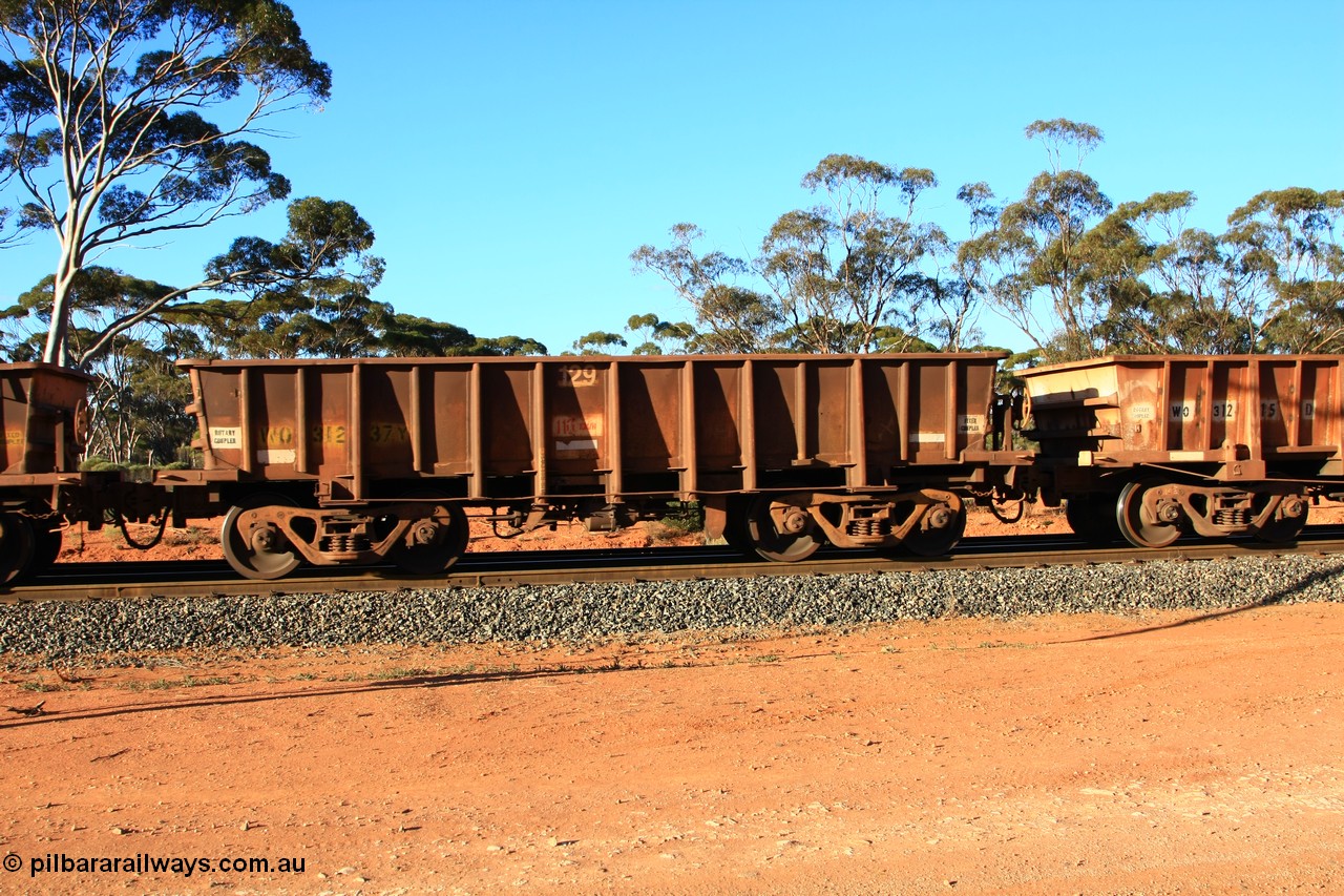 100731 03080
WO type iron ore waggon WO 31237 is one of a batch of eighty six built by WAGR Midland Workshops between 1967 and March 1968 with fleet number 129 for Koolyanobbing iron ore operations, with a 75 ton and 1018 ft³ capacity, empty train arriving at Binduli Triangle, 31st July 2010. This unit was converted to WOC for coal in 1986 till 1994 when it was re-classed back to WO.
Keywords: WO-type;WO31237;WAGR-Midland-WS;