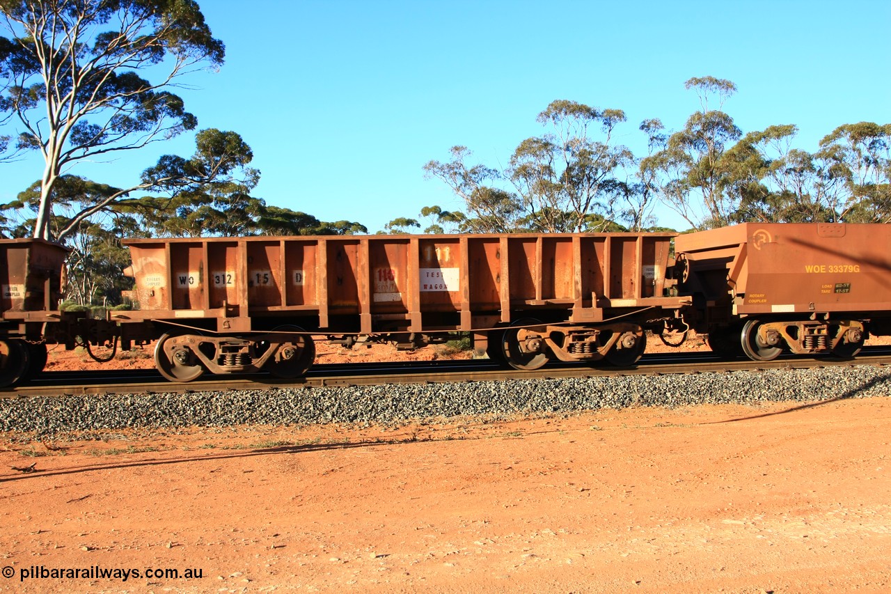 100731 03081
WO type iron ore waggon WO 31215 is one of a batch of sixty two built by Goninan WA between April and August 2000 with serial number 950086-003 and fleet number 111 for Koolyanobbing iron ore operations, marked as a TEST WAGGON, and is a Goninan built replacement WO type waggon with a build date of 04/2000, this replaces the original WAGR built WO type waggon with a WOD type with square features opposed to the curved ones as on the original WO, empty train arriving at Binduli Triangle, 31st July 2010.
Keywords: WO-type;WO31215;Goninan-WA;950086-003;