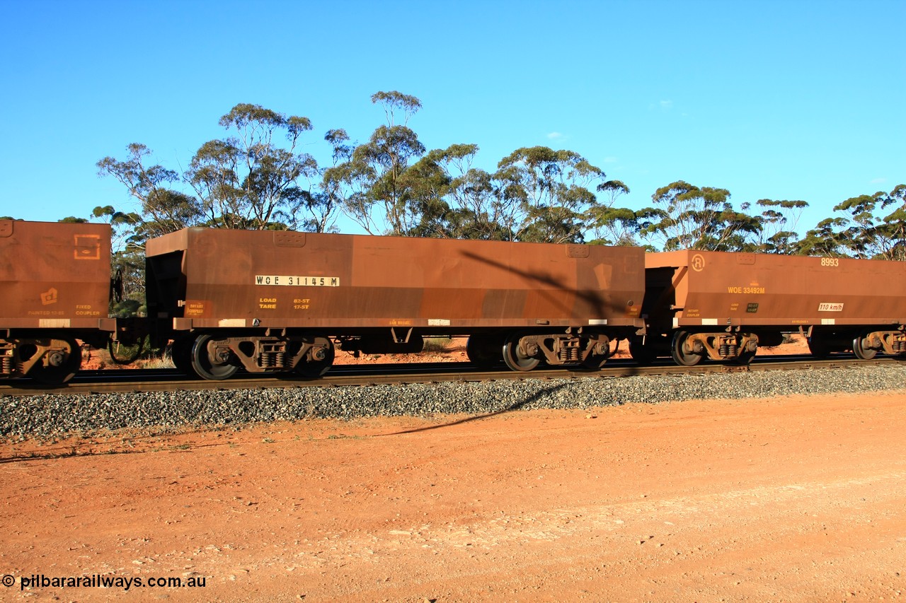100731 03113
WOE type iron ore waggon WOE 31145 is one of a batch of fifteen built by Goninan WA between April and May 2002 with fleet number 727 for Koolyanobbing iron ore operations, empty train arriving at Binduli Triangle, 31st July 2010.
Keywords: WOE-type;WOE31145;Goninan-WA;
