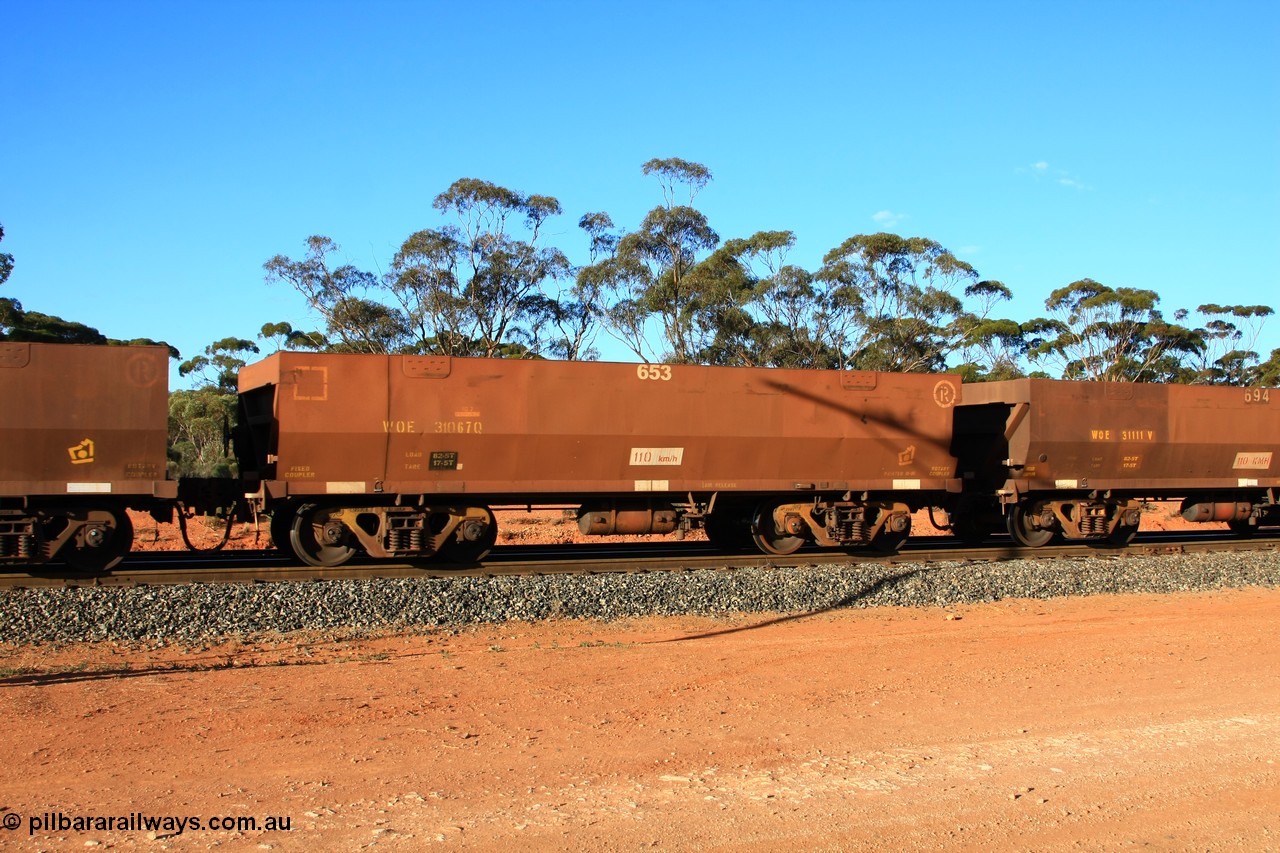 100731 03127
WOE type iron ore waggon WOE 31067 is one of a batch of one hundred and thirty built by Goninan WA between March and August 2001 with serial number 950092-057 and fleet number 653 for Koolyanobbing iron ore operations, empty train arriving at Binduli Triangle, 31st July 2010.
Keywords: WOE-type;WOE31067;Goninan-WA;950092-057;