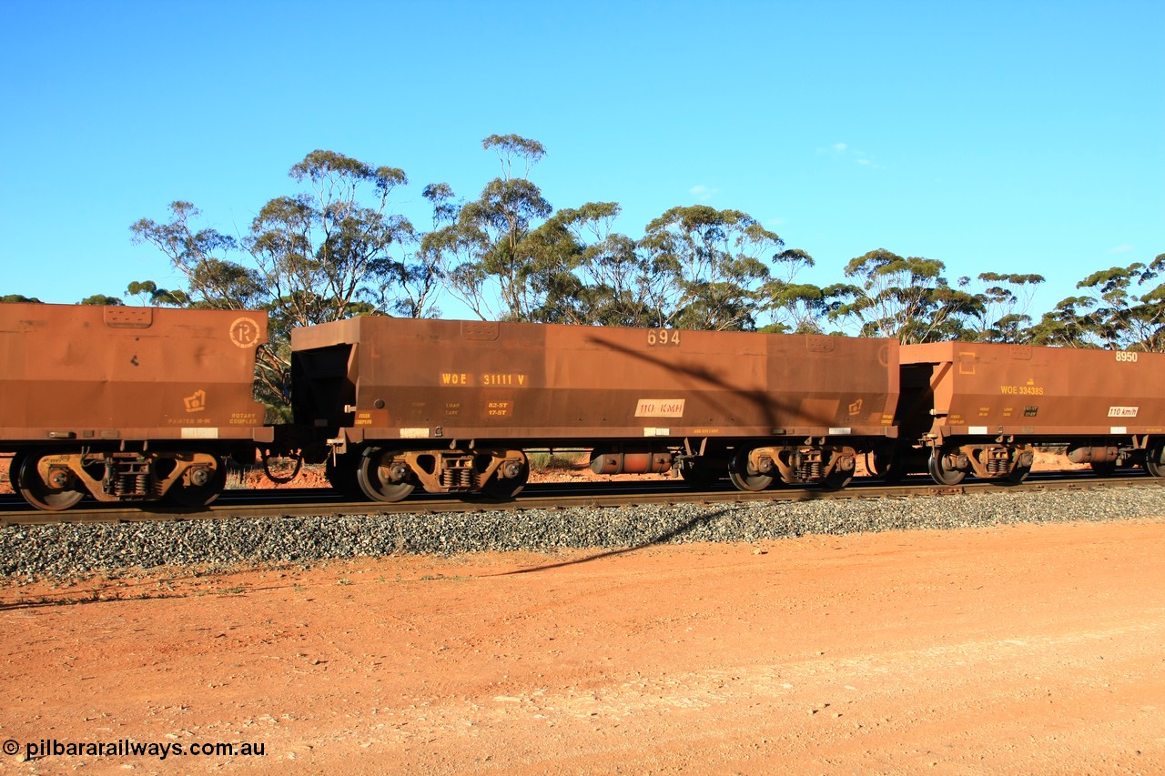 100731 03128
WOE type iron ore waggon WOE 31111 is one of a batch of one hundred and thirty built by Goninan WA between March and August 2001 with serial number 950092-101 and fleet number 694 for Koolyanobbing iron ore operations, empty train arriving at Binduli Triangle, 31st July 2010.
Keywords: WOE-type;WOE31111;Goninan-WA;950092-101;