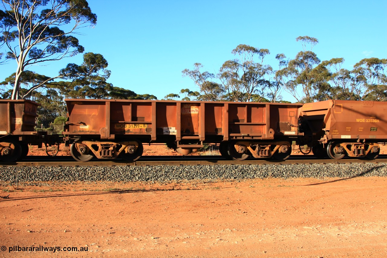100731 03141
WOB type iron ore waggon WOB 31399 is one of a batch of twenty five built by Comeng WA between 1974 and 1975 and converted from Mt Newman high sided waggons by WAGR Midland Workshops with a capacity of 67 tons with fleet number 323 for Koolyanobbing iron ore operations, empty train arriving at Binduli Triangle, 31st July 2010.
Keywords: WOB-type;WOB31399;Comeng-WA;WSM-type;Mt-Newman-Mining;
