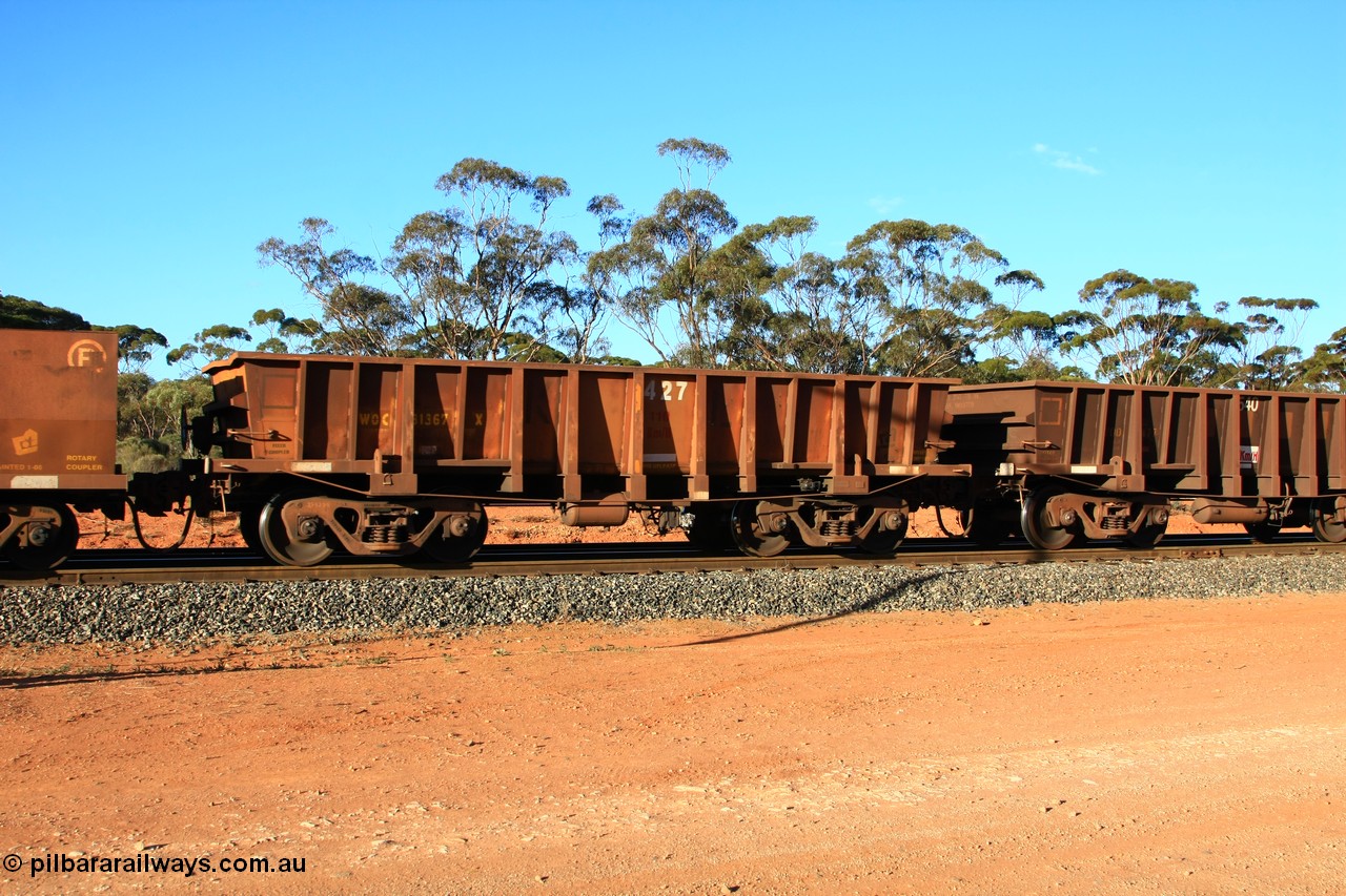 100731 03146
WOC type iron ore waggon WOC 31367 is one of a batch of thirty built by Goninan WA between October 1997 to January 1998 with fleet number 427 for Koolyanobbing iron ore operations with a 75 ton capacity and lettered for KIPL, Koolyanobbing Iron Pty Ltd, with the IP painted over, empty train arriving at Binduli Triangle, 31st July 2010.
Keywords: WOC-type;WOC31367;Goninan-WA;