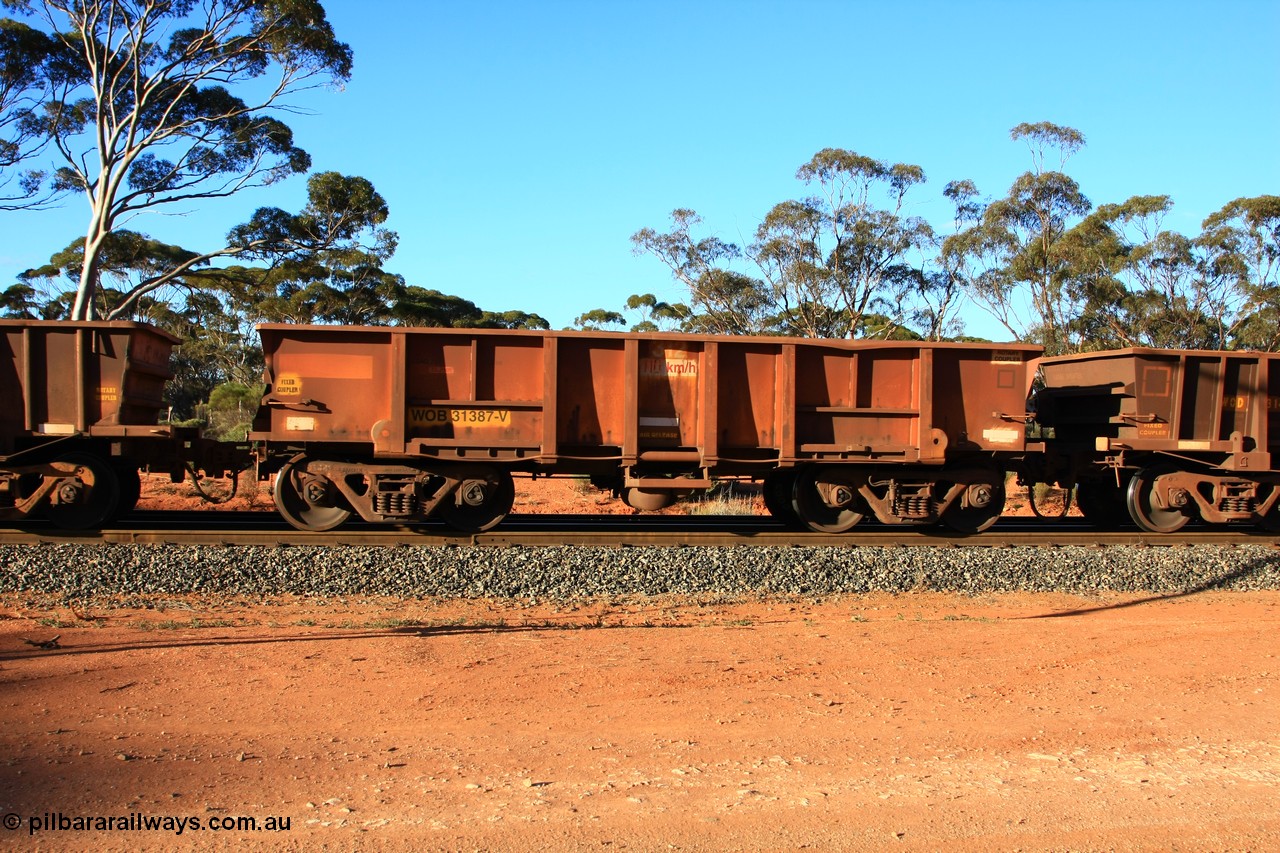 100731 03175
WOB type iron ore waggon WOB 31387 is one of a batch of twenty five built by Comeng WA between 1974 and 1975 and converted from Mt Newman high sided waggons by WAGR Midland Workshops with a capacity of 67 tons with fleet number 312 for Koolyanobbing iron ore operations. This waggon was also converted to a WSM type ballast hopper by re-fitting the cut down top section and having bottom discharge doors fitted, converted back to WOB in 1998, empty train arriving at Binduli Triangle, 31st July 2010.
Keywords: WOB-type;WOB31387;Comeng-WA;WSM-type;Mt-Newman-Mining;
