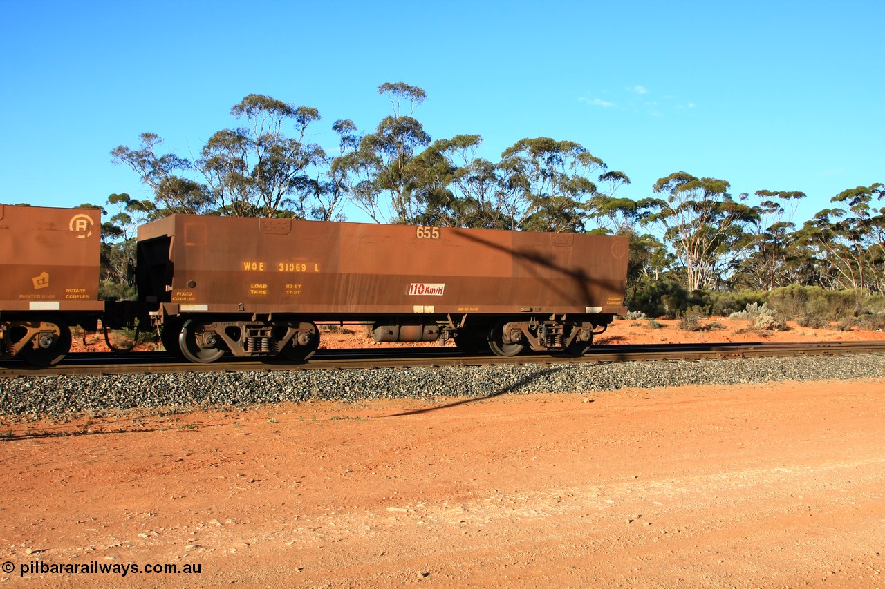 100731 03181
WOE type iron ore waggon WOE 31069 is one of a batch of one hundred and thirty built by Goninan WA between March and August 2001 with serial number 950092-059 and fleet number 655 for Koolyanobbing iron ore operations, with PORTMAN painted out and the load revised down to 72.5 tonnes, empty train arriving at Binduli Triangle, 31st July 2010.
Keywords: WOE-type;WOE31069;Goninan-WA;950092-059;