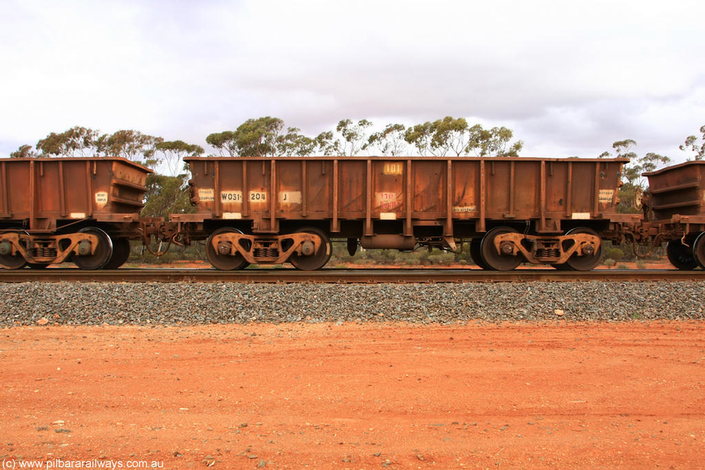 100822 5934
WO type iron ore waggon WO 31204 is one of a batch of eighty six built by WAGR Midland Workshops between 1967 and March 1968 with fleet number 101 for Koolyanobbing iron ore operations with a 75 ton and 1018 ft.³ capacity, Binduli Triangle 22nd August 2010. This unit was converted to WOS superphosphate in the late 1980s till 1994 when it was re-classed back to WO.
Keywords: WO-type;WO31204;WAGR-Midland-WS;WOS-type;