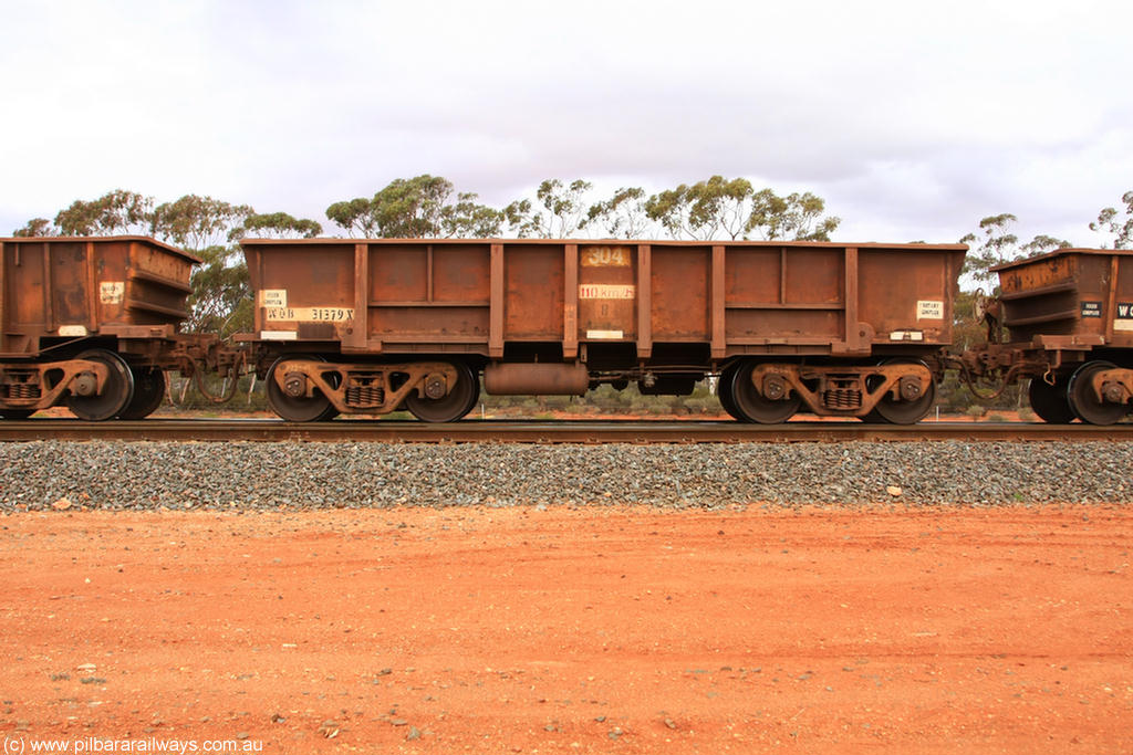 100822 5940
WOB type iron ore waggon WOB 31379 is one of a batch of twenty five built by Comeng WA between 1974 and 1975 and converted from Mt Newman high sided waggons by WAGR Midland Workshops with a capacity of 67 tons with fleet number 304 for Koolyanobbing iron ore operations, the WAGR and Comeng builders plates are visible in the waggon sill, Binduli Triangle 22nd August 2010.
Keywords: WOB-type;WOB31379;Comeng-WA;Mt-Newman-Mining;
