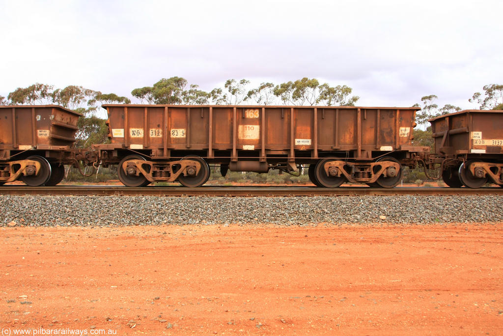 100822 5941
WO type iron ore waggon WO 31283 is one of a batch of eighty six built by WAGR Midland Workshops between 1967 and March 1968 with fleet number 163 for Koolyanobbing iron ore operations, with a 75 ton and 1018 ft³ capacity, Binduli Triangle 22nd August 2010. This unit was converted to WOS superphosphate in the late 1980s till 1994 when it was re-classed back to WO.
Keywords: WO-type;WO31283;31283;WAGR-Midland-WS;WOS-type;