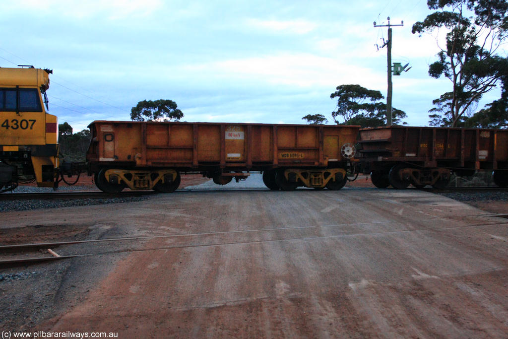 100822 6204
WOB type iron ore waggon WOB 31395 is one of a batch of twenty five built by Comeng WA between 1974 and 1975 and converted from Mt Newman high sided waggons by WAGR Midland Workshops with a capacity of 67 tons with fleet number 325 for Koolyanobbing iron ore operations. This waggon was also converted to a WSM type ballast hopper by re-fitting the cut down top section and having bottom discharge doors fitted, converted back to WOB in 1997, in ARG yellow, on empty train 1416 at Hampton, 22nd August 2010.
Keywords: WOB-type;WOB31395;Comeng-WA;WSM-type;Mt-Newman-Mining;