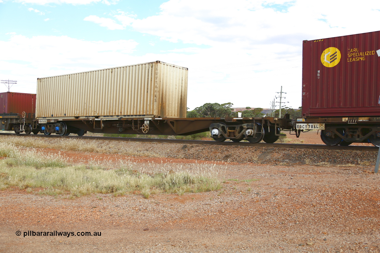 210407 9870
Parkeston, 2MP5 intermodal train, RQFY type flat waggon RQFY 49, originally built by Victorian Railways Newport Workshops as an QMX type skeletal container flat in the second batch of twenty such waggons in 1978. Loaded with a 40' Austrans 4FG1 type container AUCU 412410.
Keywords: RQFY-type;RQFY49;Victorian-Railways-Newport-WS;QMX-type;VQFX-type;RQFX-type;RQFF-type;