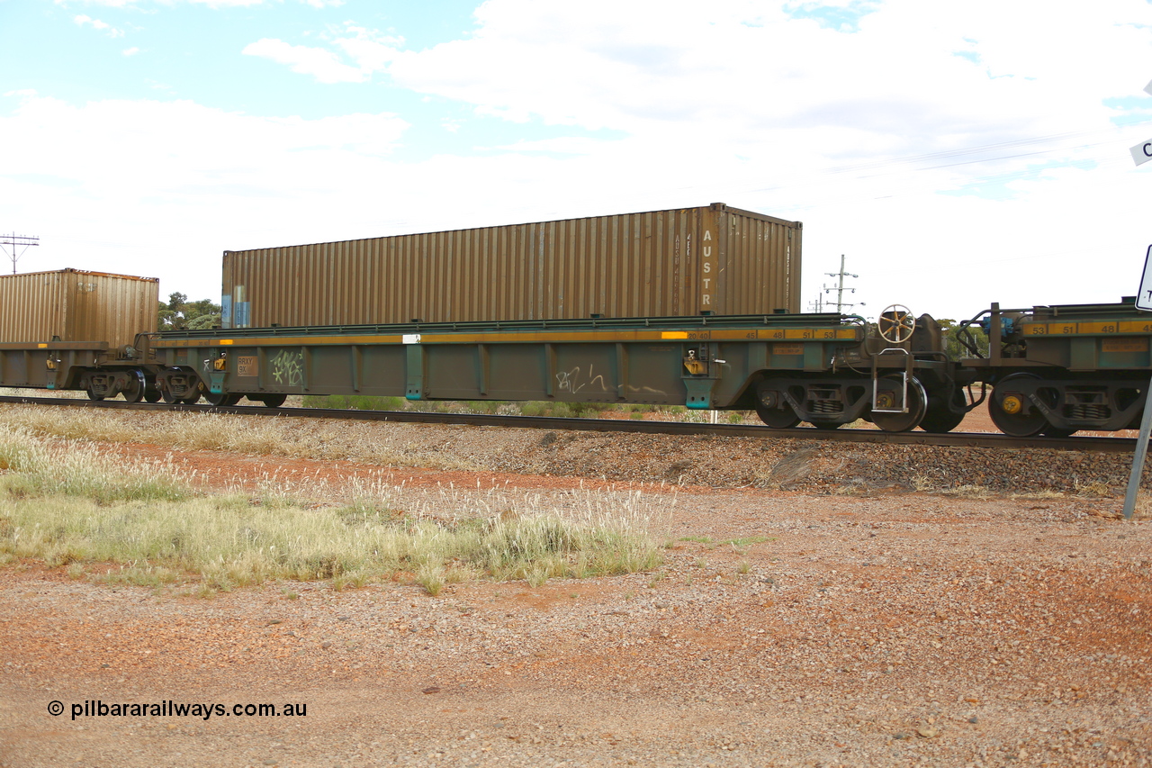 210407 9872
Parkeston, 2MP5 intermodal train, RRXY 9, platform 4 with an Austrans 40' 4EG1 type container AUSU 409608. The RRXY type 5-pack well waggon set is one of eleven built by Bradken Qld in 2002 for Toll from a Williams-Worley design.
Keywords: RRXY-type;RRXY9;Williams-Worley;Bradken-Rail-Qld;