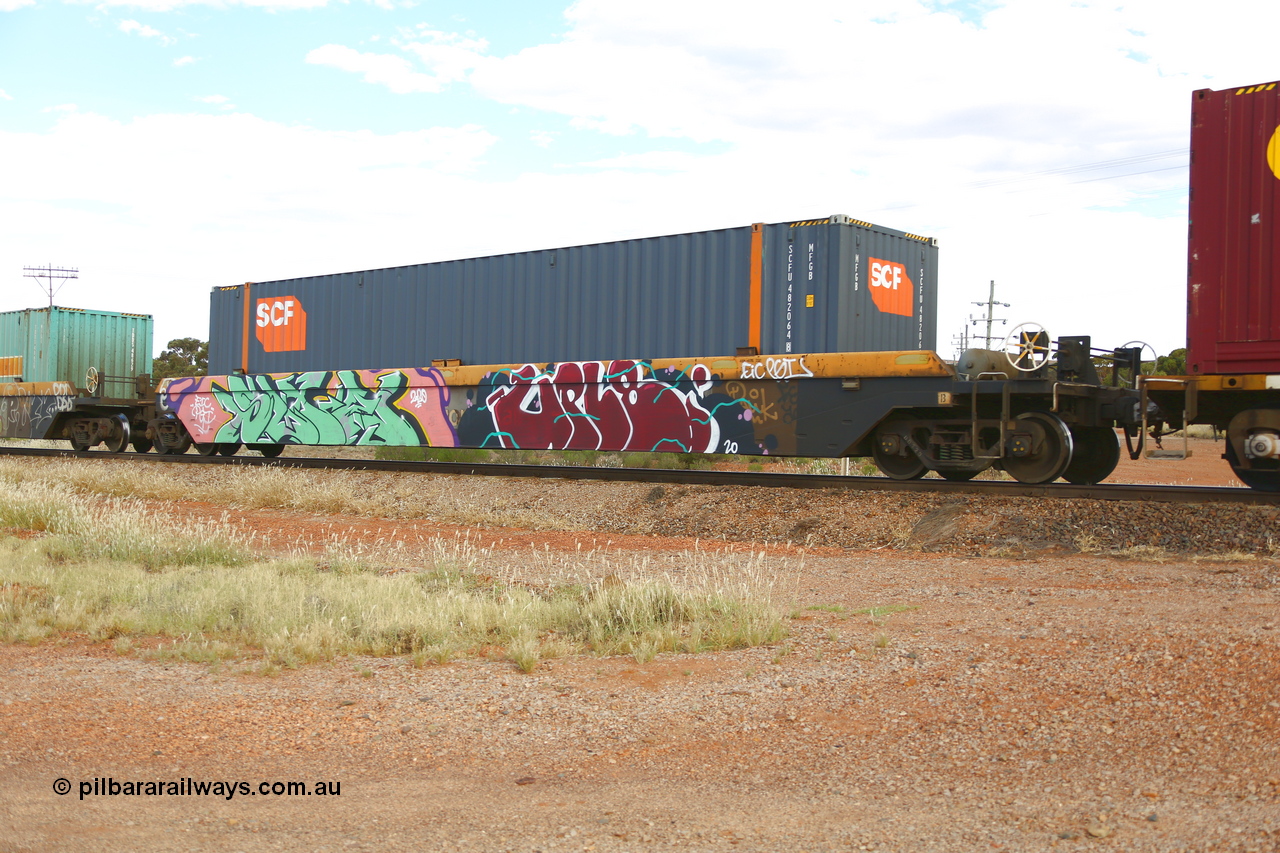 210407 9886
Parkeston, 2MP5 intermodal train, RRZY 7049 platform 5 of 5-pack well waggon set. Originally was an RQZY type, a five unit bar coupled well container waggon built as one of a batch of thirty two by Goninan NSW for National Rail in 1995/96. Recoded to RRZY when repaired. Loaded with an SCF 48' MFGB type container SCFU 482064.
Keywords: RRZY-type;RRZY7049;Goninan-NSW;RQZY-type;