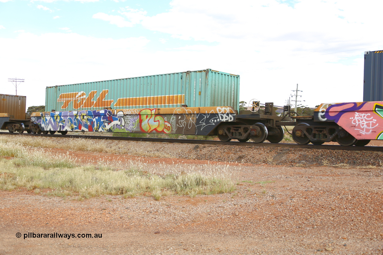 210407 9887
Parkeston, 2MP5 intermodal train, RRZY 7049 platform 4 of 5-pack well waggon set. Originally was an RQZY type, a five unit bar coupled well container waggon built as one of a batch of thirty two by Goninan NSW for National Rail in 1995/96. Recoded to RRZY when repaired. Loaded with a Toll 48' MFG1 type container TCML 48629.
Keywords: RRZY-type;RRZY7049;Goninan-NSW;RQZY-type;