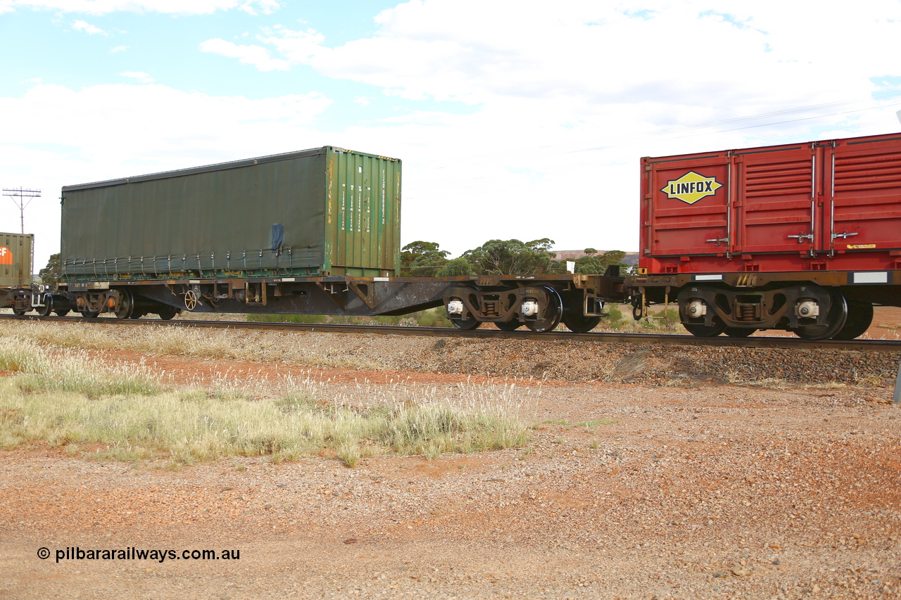 210407 9900
Parkeston, 2MP5 intermodal train, RQFY type flat waggon RQFY 119 is a VQFX type skeletal container waggon built by Victorian Railways Bendigo Workshops in 1980 in a batch of seventy five. Recoded to VQFY in 1985, then to RQFY in 1994, then National Rail RQFF in 1995. Loaded with a 40' curtain sider container FICU 000002.
Keywords: RQFY-type;RQFY119;Victorian-Railways-Bendigo-WS;VQFX-type;VQFY-type;RQFF-type;