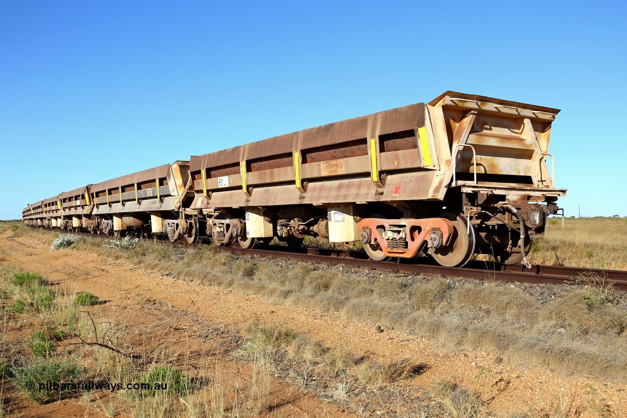 180527 1200
Pippingarra, near the 17 km on the former Goldsworthy line, BHP has stored some redundant service waggons, Difco side dumps, a couple of heavy weights and the old winch and crib waggons from the steel train. Looking east with a former GML short Difco side dump waggon on the end. 27th May 2018. [url=https://goo.gl/maps/duWQ1f8kqf92]GeoData[/url].
