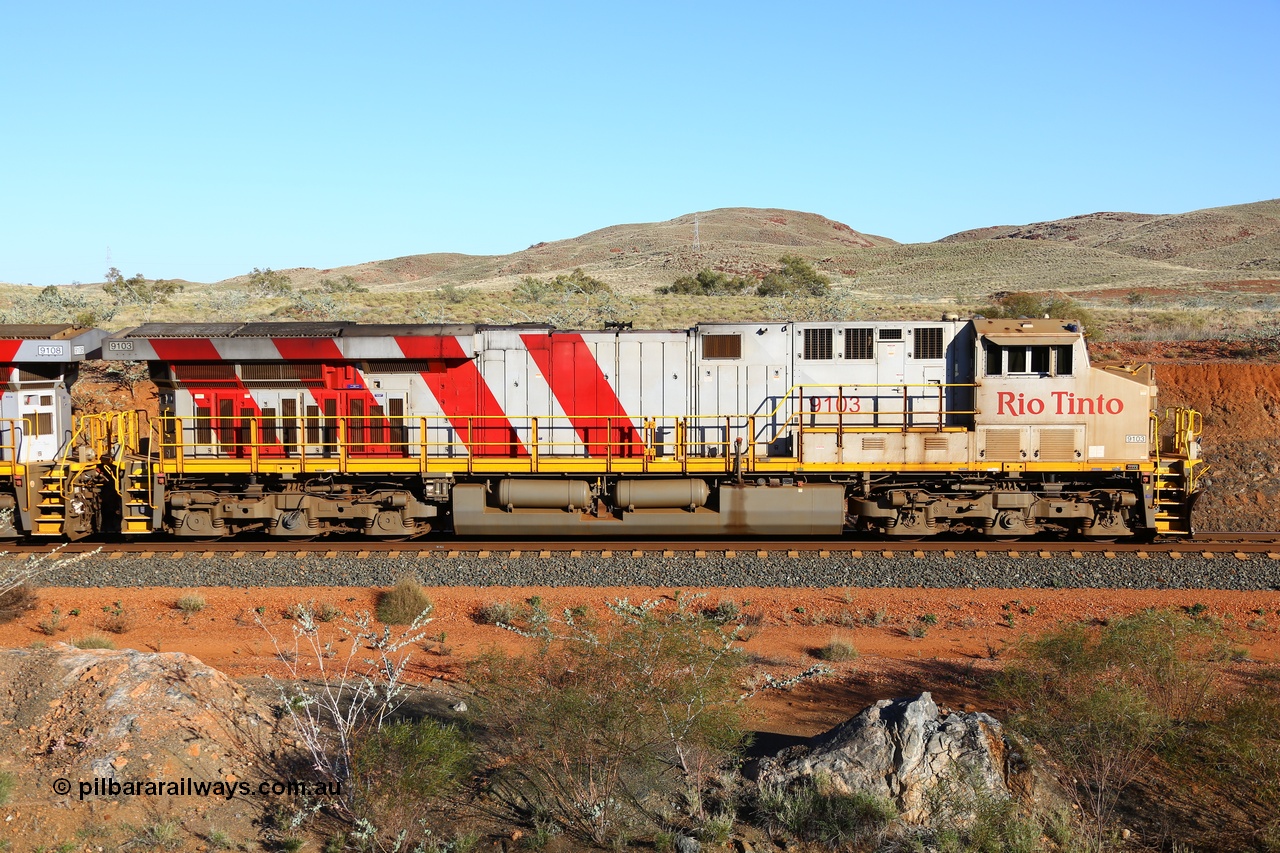 180616 1659
Cooya Pooya, 32 km on the Cape Lambert line, Rio Tinto loco 9103 with serial 61941 a GE Erie built GE model ES44ACi from the 1st order in Rio Tinto Stripes livery side view, following a total loss of air, the locomotive's hose bag is chained to the rail in case of movement. The train pulled a coupling around the 45 car position. 16th June 2018. [url=https://goo.gl/maps/ckyFypg4LAy]Geodata[/url]
Keywords: 9103;GE;ES44ACi;61941;Rio-Tinto-Stripes;