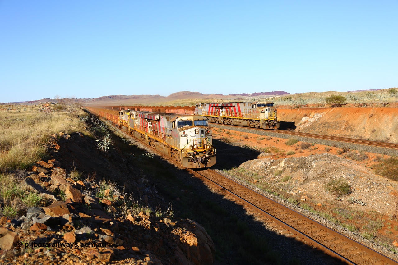 180616 1668
Cooya Pooya, at the 32 km on the Cape Lambert line a loaded HIY train on the East Mainline led by Rio Tinto loco 8142 with serial 58723 a GE Erie built GE model ES44DCi from the 3rd order in Rio Tinto Stripes livery as it powers past the disabled train stabled on the West Mainline with sister 8158 and Dash 9-44CW 9428 assisting 8142. 16th June 2018. [url=https://goo.gl/maps/LdE1Ly5DDHE2]GeoData[/url].
Toad Montgomery image.
Keywords: 8142;GE;ES44DCi;58723;Rio-Tinto-Stripes;
