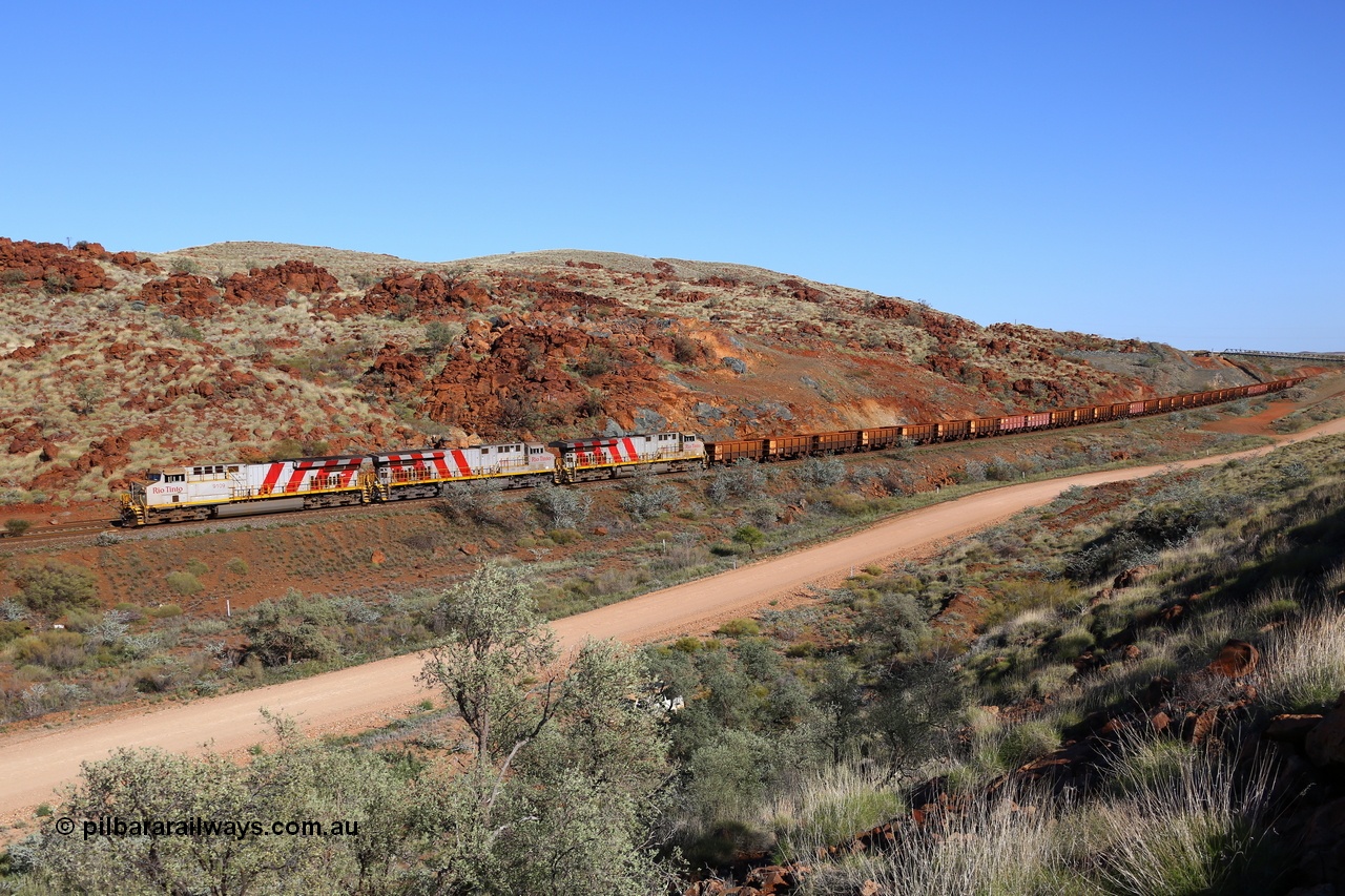 180616 1687
Cooya Pooya, an empty Robe Valley train with triple ES44ACi units on the lead, Rio Tinto loco 9109 with serial 62540 a GE Erie built GE model ES44ACi from the 2nd order in Rio Tinto Stripes livery leads sister General Electric built 9128 and 9106 all in Rio Tinto stripe livery with a load of 'J cars' at the 38 km, 16th June 2018. [url=https://goo.gl/maps/dRaSPJeJddq]GeoData[/url].
Keywords: 9109;GE;ES44ACi;62540;Rio-Tinto-Stripes;