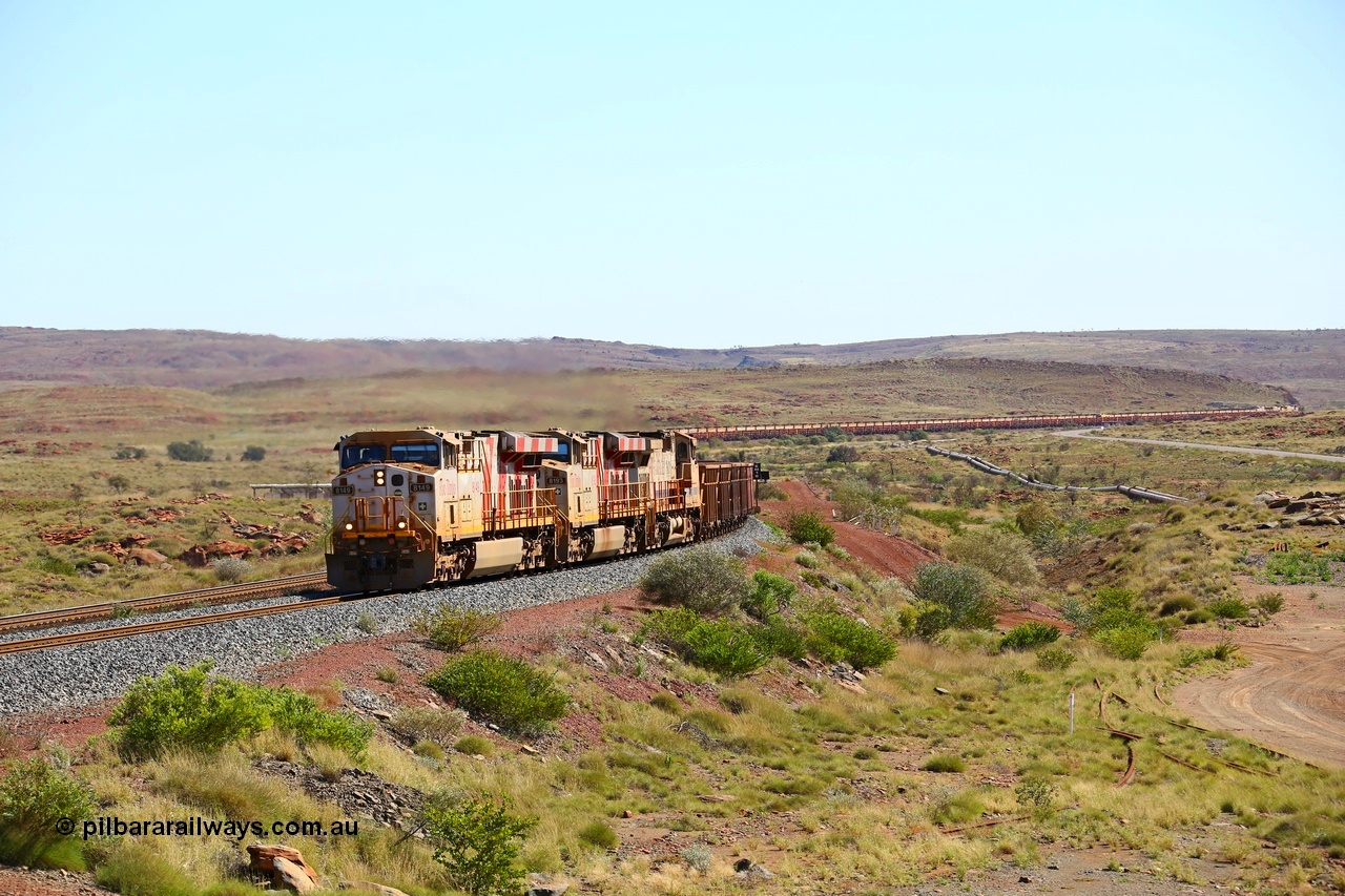 180616 1810
Emu Siding, an empty train from Cape Lambert powers upgrade away from Emu Siding up the 1.6 percent grade behind Rio Tinto loco 8149 with serial 58730 a GE Erie built GE model ES44DCi from the 3rd order in Rio Tinto Stripes livery and 8193 with Dash 9-44CW unit 7089 with a consist of S and C type waggons. 16th June 2018. [url=https://goo.gl/maps/M5Nc32gSiLy]GeoData[/url].
Keywords: 8149;GE;ES44DCi;58730;Rio-Tinto-Stripes;