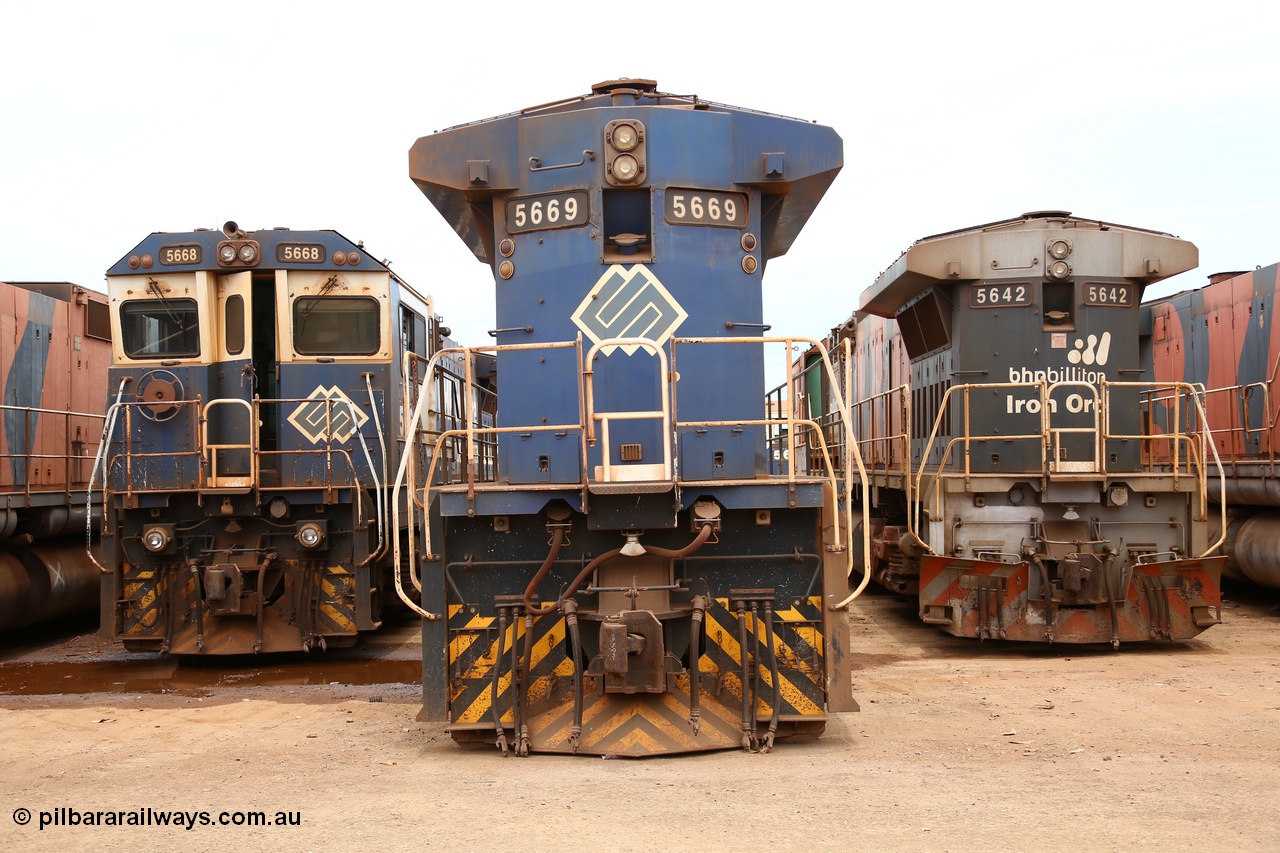 160128 00407
Wedgefield, Sims Metal Yard, rear view of Goninan rebuilt GE model CM40-8MEFI 5669 serial 8412-02, builders no. 95-160 flanked on the left by sister unit 5668 and on the right by older CM40-8M 5642. Note the newer rebuilds have marker lights while 42 has none but has a snow plough on the no. 2 end. Also note the roof access ladder rungs have been removed.
Keywords: 5669;Goninan;GE;CM40-8EFI;8412-02/95-160;rebuild;Comeng-NSW;ALCo;M636C;5486;C6084-2;