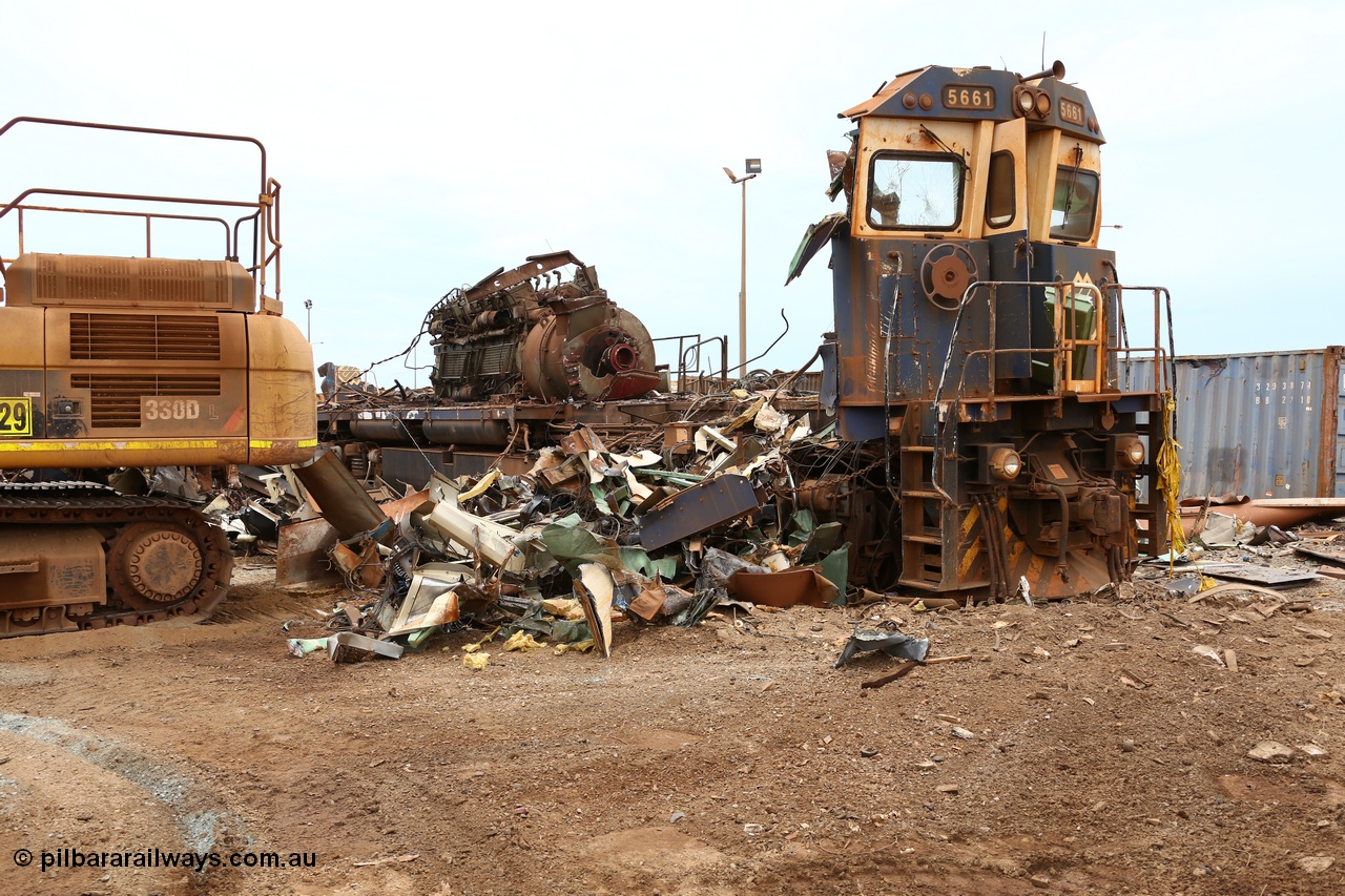 160128 00875
Wedgefield, Sims Metal Yard, reduced to just the front wall and the 7FDL-16 engine sticking above frame level, BHP Billiton Goninan rebuild CM40-8M locomotive 5661 serial 8412-06/94-152 is almost gone.
Keywords: 5661;Goninan;GE;CM40-8M;8412-06/94-152;rebuild;Comeng-NSW;ALCo;M636C;5488;C6084-4;