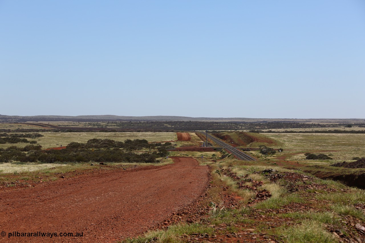 150505 7953
FMG Solomon Line, looking west with cutting to the right, 227.5 km grade crossing in the distance, track is curving away to the left in the background. Geodata: [url=https://goo.gl/maps/fkHYybyjbU42] -22.0200283 118.5880600 [/url].
