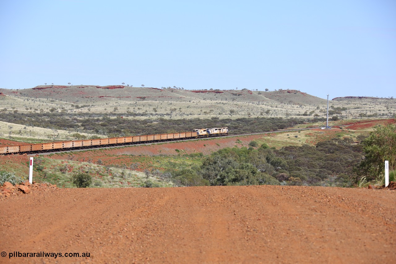 150508 8116
FMG Solomon Line, empty train lead by triple combination of General Electric Dash 9-44CW 004 serial 58181, EMD SD90MAC-H 916 serial 976833-22 and EMD SD70ACe 710 serial 20118693-002 power through the hills around the Bea Bea Creek area. Geodata: [url=https://goo.gl/maps/nBtezda3P8n] -22.0528200 118.7132450 [/url].
