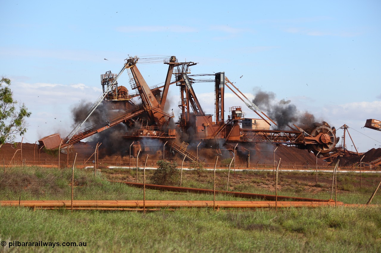 150518 8120
BHP Iron Ore old and retired ore stacker #4 and bucket wheel reclaimer #4 are blown apart to aid in the scrapping process.
