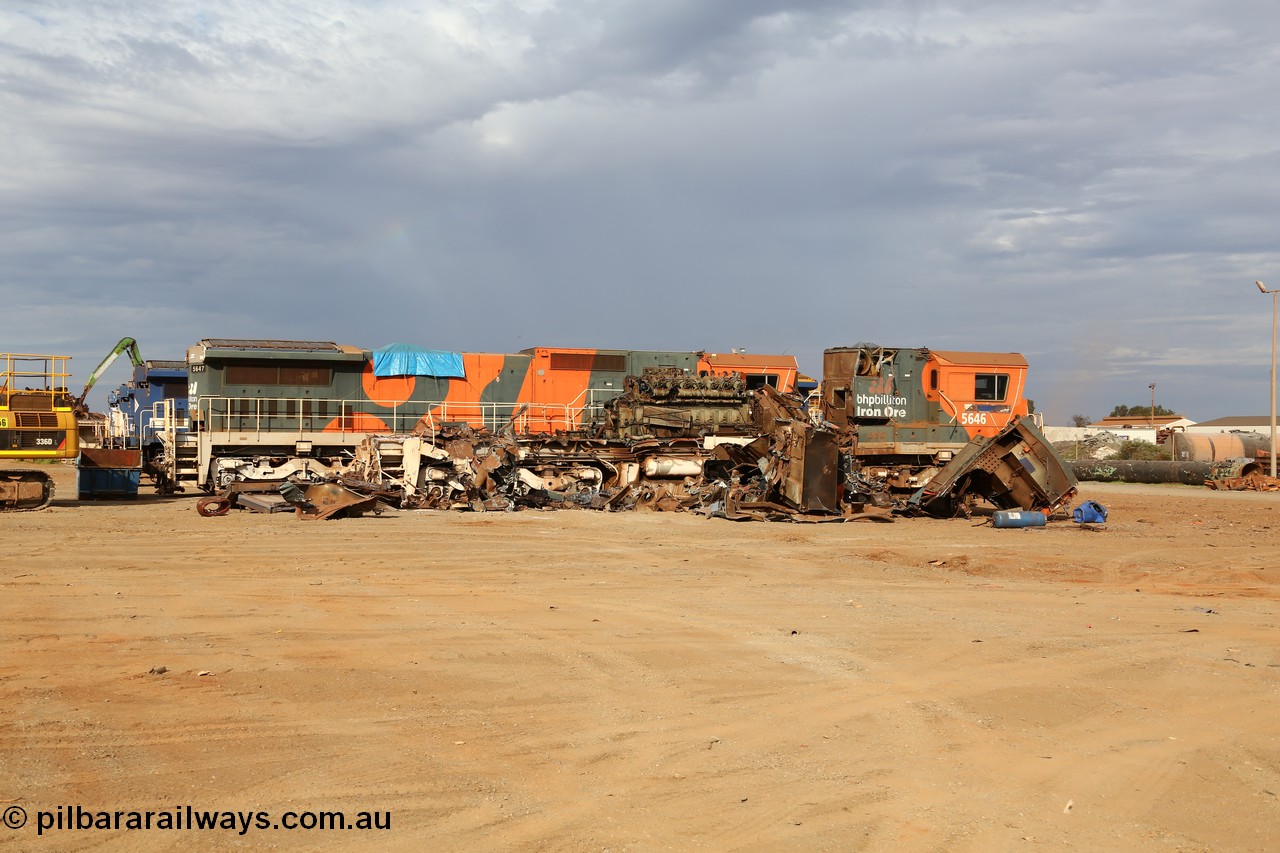 150522 8156
Wedgefield, Sims Metal yard, the first batch of BHP Billiton Dash 8 locos to be scrapped, 5646 serial 8244-11/92-135 one of a pair of new Goninan WA built CM40-8 units has already had most of the hood removed and the V16 7FDL prime mover is visible, sister unit 5647 sit along side with the same fate coming up next.
Keywords: 5646;Goninan;GE;CM40-8;8244-11/92-135;