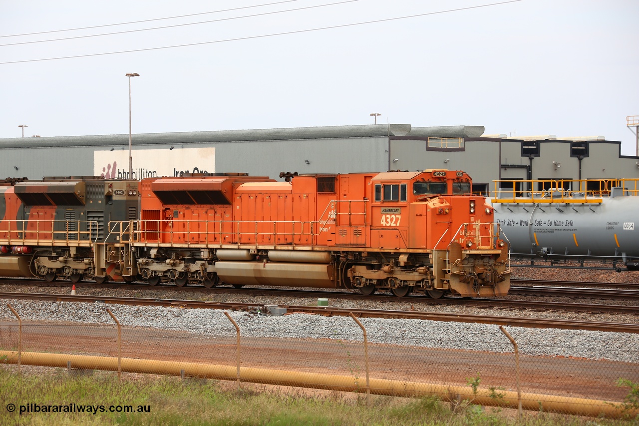 150523 8238
Nelson Point Yard, BHP Billiton SD70ACe unit leads a rake towards the dumpers. Lead unit 4327 'Hamersley' is from an order originally being built by Electro-Motive, London Ontario for BNSF, an US class 1 railroad, but BHP secured 10 of them during construction, this unit 4327 serial no. 20066862-056 was destined to be BNSF 9185 before coming to BHP.
