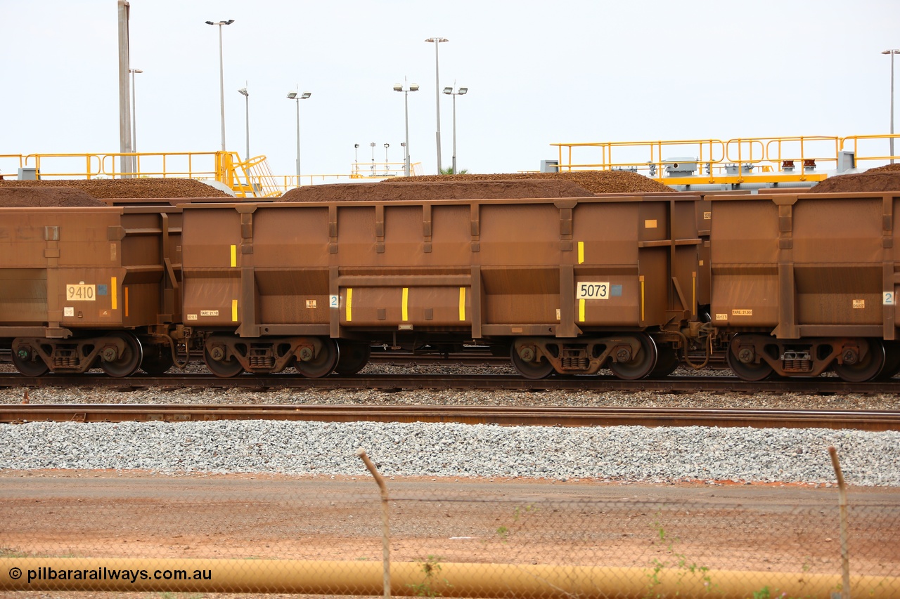150523 8242
Nelson Point Yard, loaded ore waggon 5073, a Golynx style waggon built by Goninan, serial no. 950126-114 in 2004 with 5Cr12Ti stainless steel which does away with the need to paint the waggon interiors to prevent wear.
Keywords: Goninan-WA;Golynx;BHP-ore-waggon;