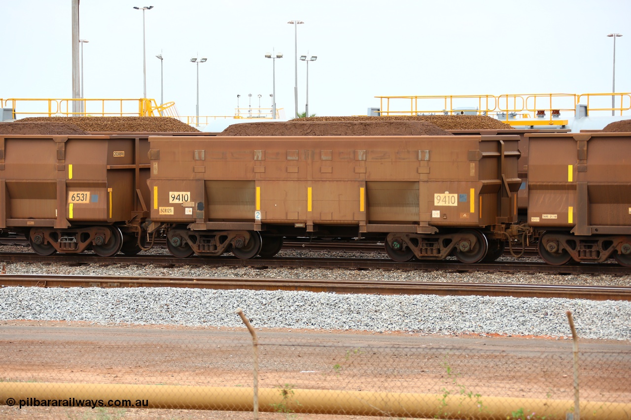 150523 8243
Nelson Point Yard, loaded ore waggon 9410, a smooth sided style waggon built by Bradken with 5Cr12Ti stainless steel which does away with the need to paint the waggon interiors to prevent wear.
Keywords: Bradken-NSW;BHP-ore-waggon;